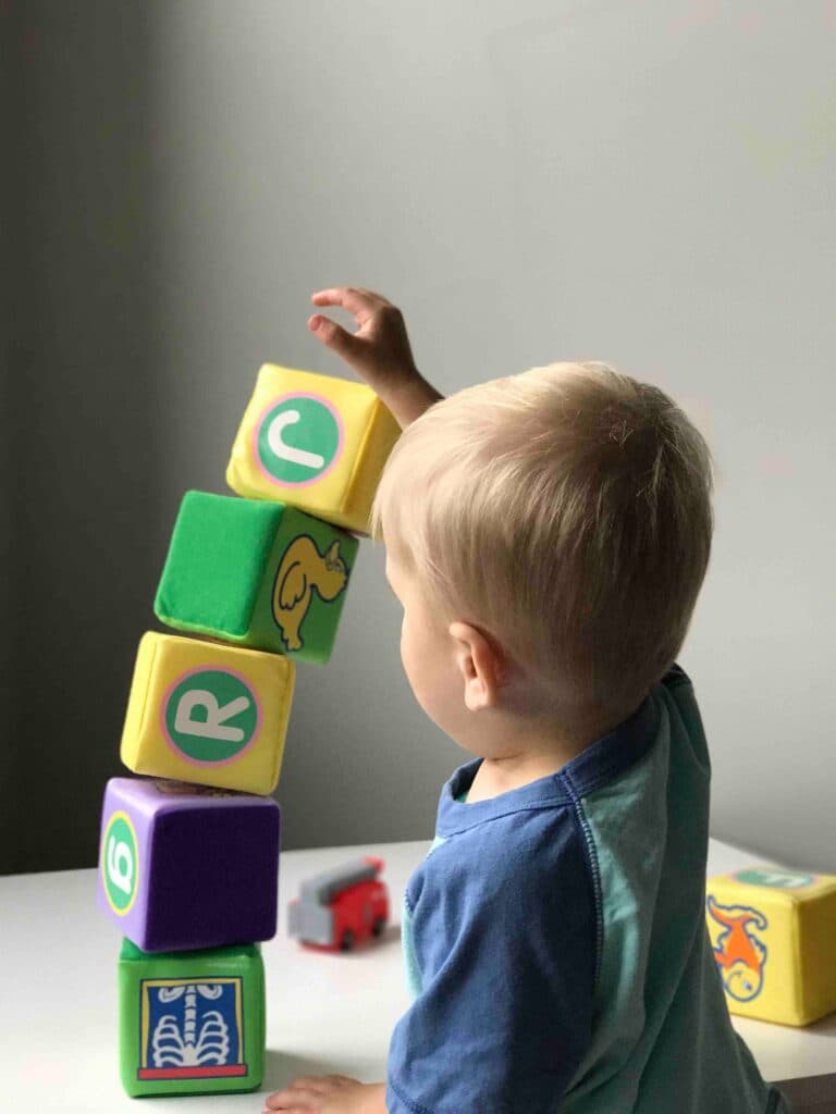 Young child building with blocks