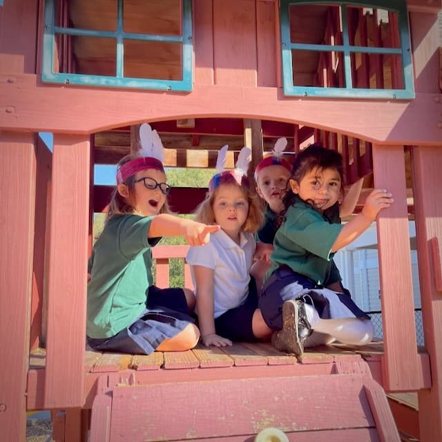 Pre Kindergarten students playing on playground