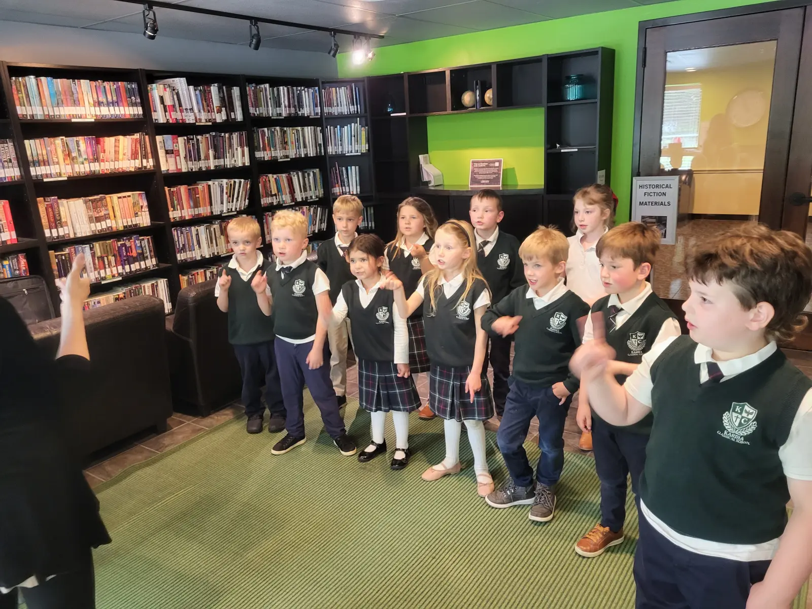 A Kardia class standing in a classroom in their formal uniforms.
